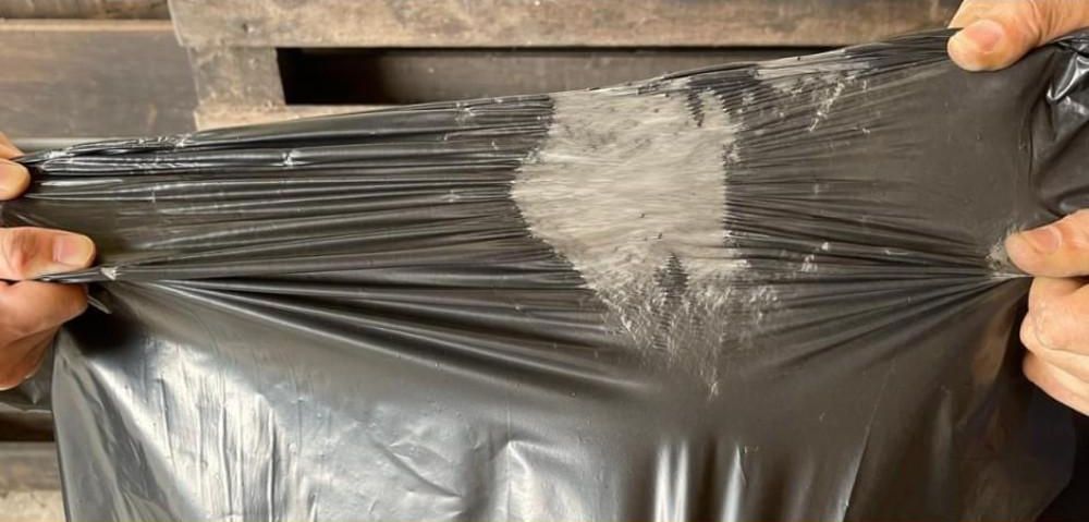 Bag film being stretched by hand